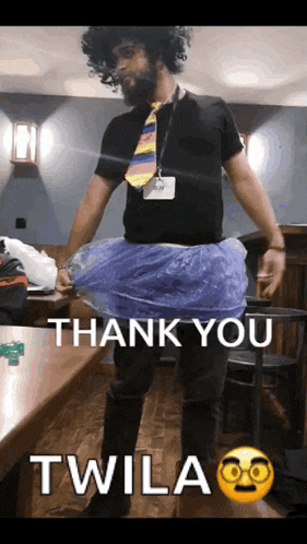 a man wearing a tie and a blue skirt says thank you twila on the bottom