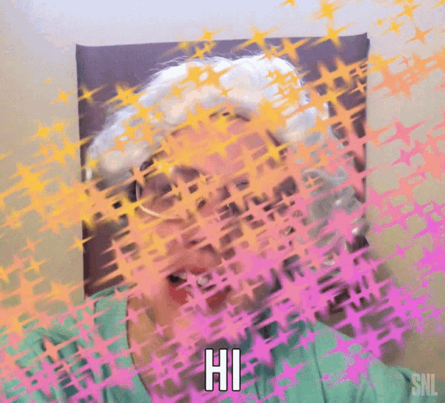 an older woman is sitting in a chair and says hi .