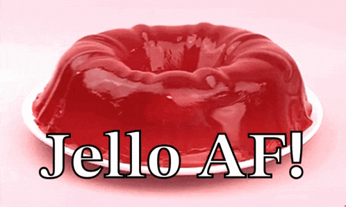 a piece of red jelly on a white plate with the words jello af written below it