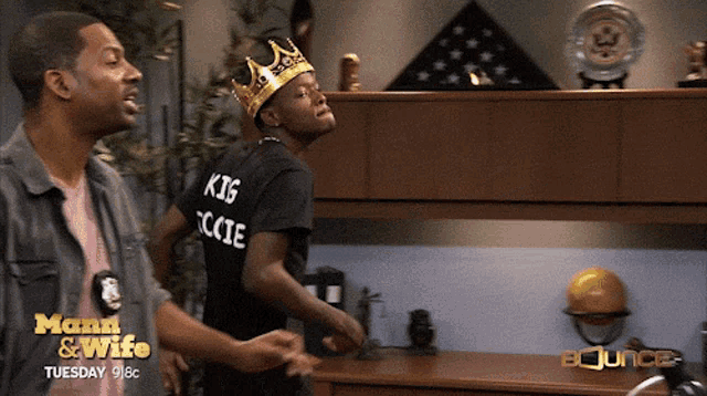 a man in a black shirt that says king ccie
