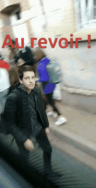 a blurry picture of a man walking down a street with the words au revoir in red letters