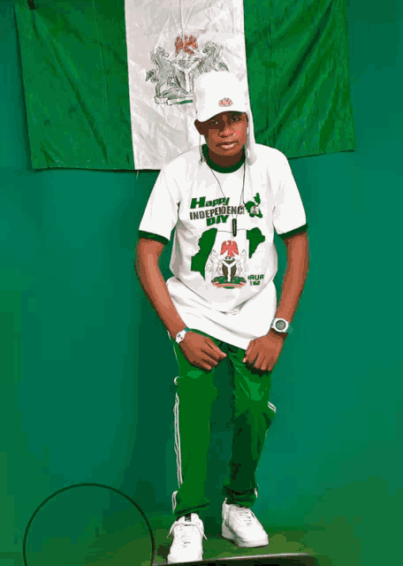 a man wearing a white shirt that says happy independence day