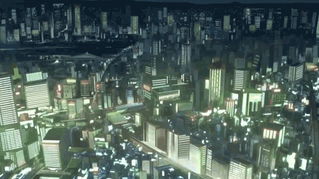 an aerial view of a city at night with a lot of buildings