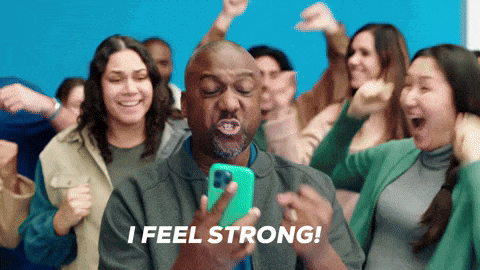 a man holding a cell phone with the words " i feel strong " on the bottom