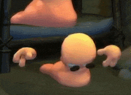 a cartoon worm is crawling on the floor next to a person 's feet .