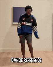 a man in a sonic jacket is dancing in a room with the words dance reference below him