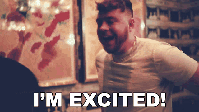 a man is laughing with the words " i 'm excited " below him