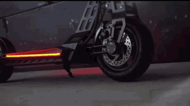 a row of scooters are sitting in a dark room