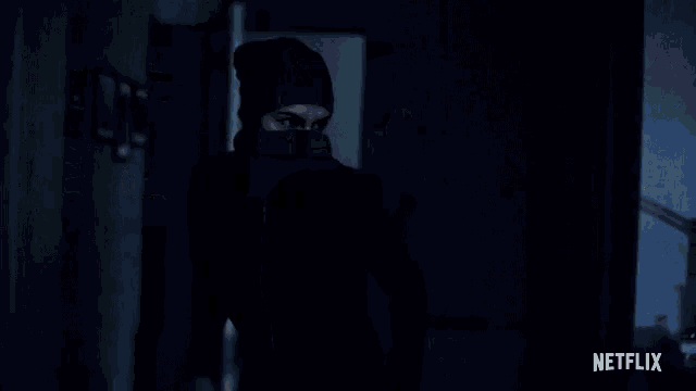 a blurred image of a person with a netflix logo behind them