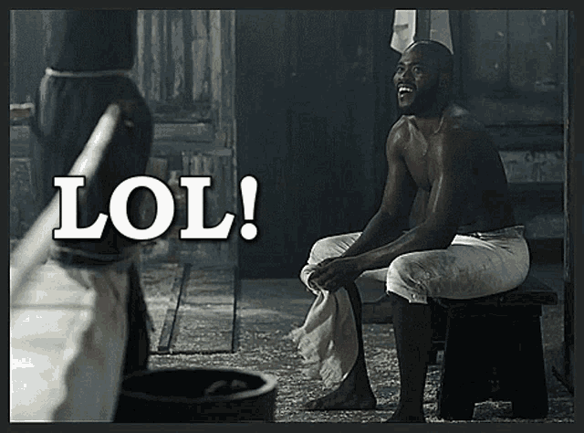 a shirtless man sits on a stool with the word lol behind him