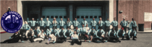 a group of people standing in front of a building that says san andreas on it
