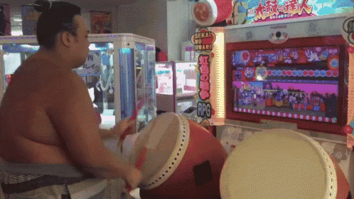 a man is playing a video game called sekai no umaru