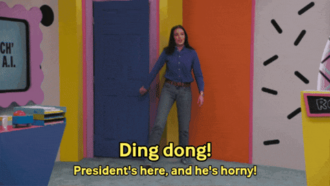 a woman standing in front of a door that says ding dong