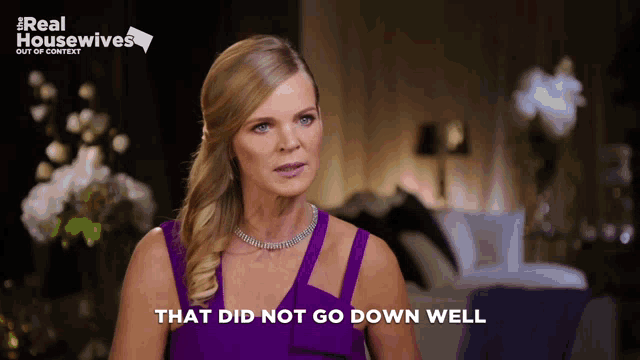 a woman in a purple dress with the words that did not go down well next to her