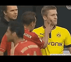 a soccer player wearing a yellow and red jersey with the word vonik on it