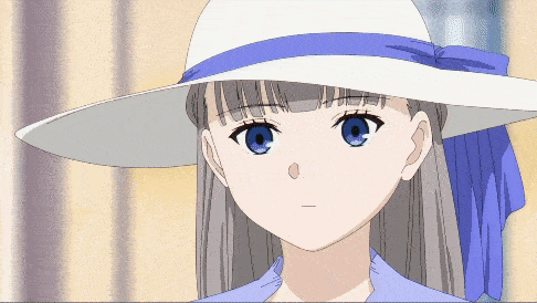 a girl in a white hat with a blue ribbon