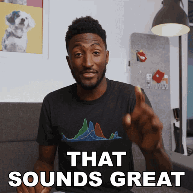 a man wearing a black t-shirt that says that sounds great