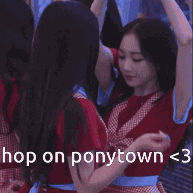 a girl in a red dress is hugging another girl in a blue dress with the words " hopon ponytown < 3 "