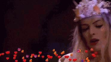 a painting of a woman with hearts coming out of her hair .