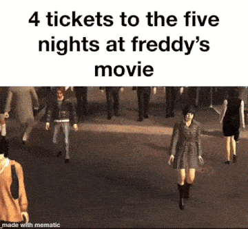 a group of people are walking down a street and a woman is walking in front of them .