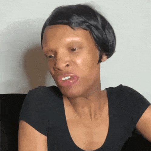 a woman with a wig on her head is making a face