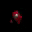 a red object is floating in the dark .