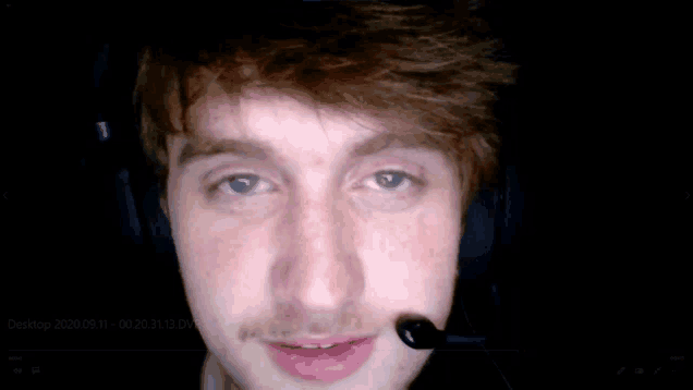 a close up of a man wearing headphones and a microphone with a date stamp of 2020/09/11