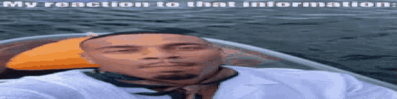 a man in a white shirt and tie is sitting in a boat .