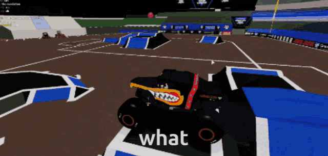 a monster truck in a video game with the word what in the corner