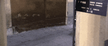 a sign that says ' s piano ' on it next to a door