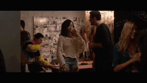 a group of people are gathered in a room with a bulletin board behind them that says " falls & associates " on it
