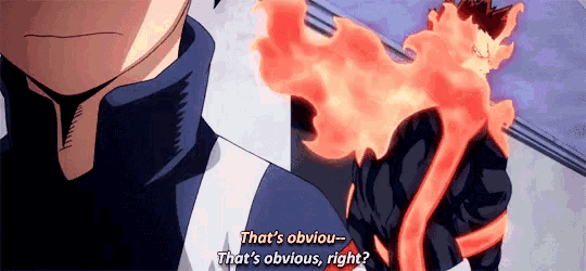a man is standing next to another man with a fire coming out of his chest .