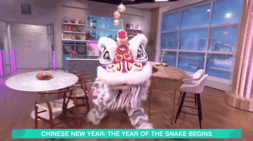 a chinese new year advertisement with a lion dancing