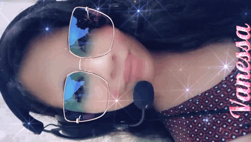 a woman wearing glasses and a headset with the name vanessa written on the bottom