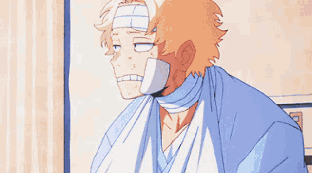 a man with a bandage on his head and a bandage on his face