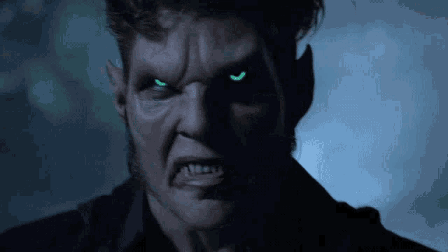 a close up of a werewolf with bright green eyes