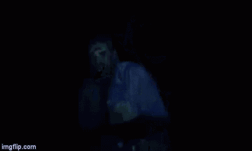 a man in a white shirt and tie is making a funny face .