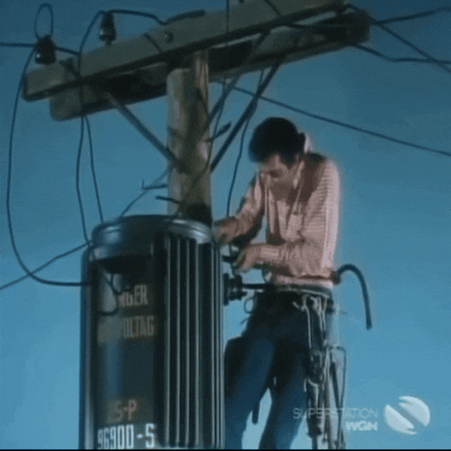 a man is working on a transformer that has the number 66900-5 on it