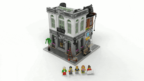 a lego model of a building with a green sign