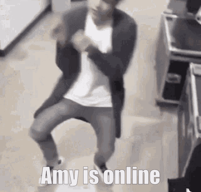a man is dancing in a room with the words amy is online written above him .