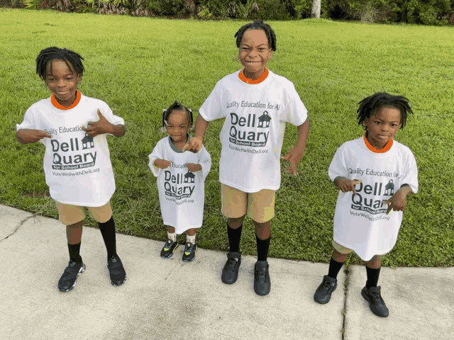 a group of children wearing dell quarry t-shirts
