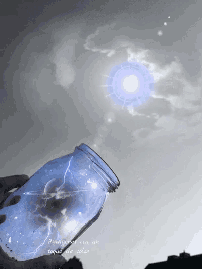 a person is holding a mason jar with a lightning bolt in it