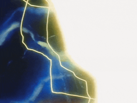 a close up of a lightning strike on a blue background