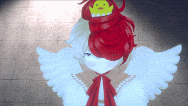 a girl with red hair has a yellow duck on her head