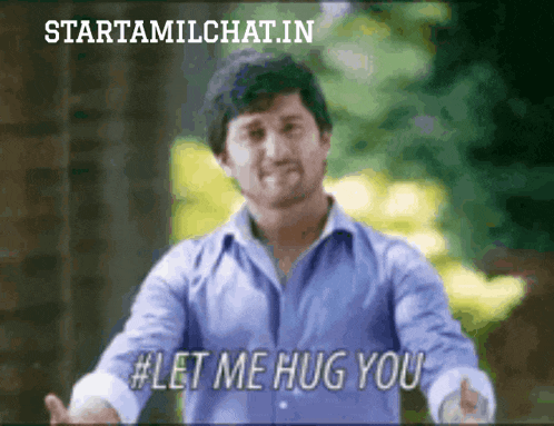 a man in a blue shirt is giving a hug and says let me hug you
