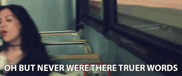a woman sitting on a bus with the words " oh but never were there truer words "