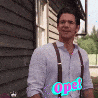 a man wearing suspenders is standing in front of a building with the word ope written on his shirt