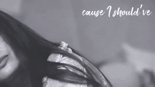 a black and white photo of a woman with the words " cause i should 've " above her