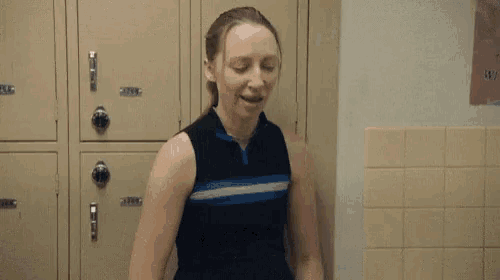 a woman in a locker room with the words i 'm on a hunger strike