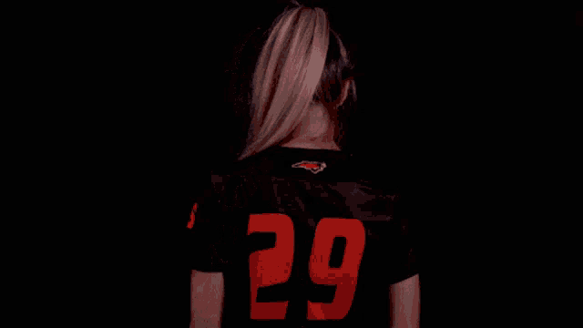 a girl wearing a black shirt with campbell on it